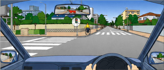 Driver turning left at an intersection as a cyclist approaches the crosswalk