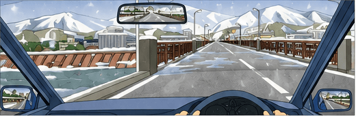 Driver approaching an icy bridge in a snowy mountain area