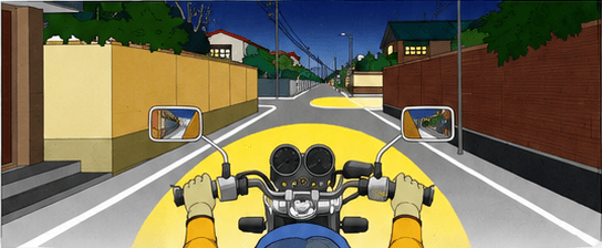 Motorcyclist approaching a poorly visible intersection from a narrow road at night