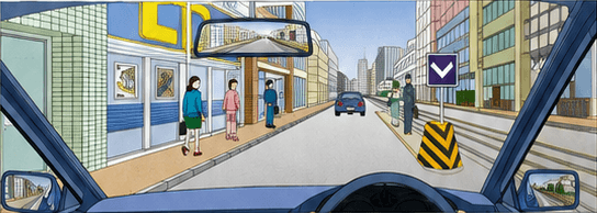 Driver approaching pedestrians beside and within a streetcar safety zone